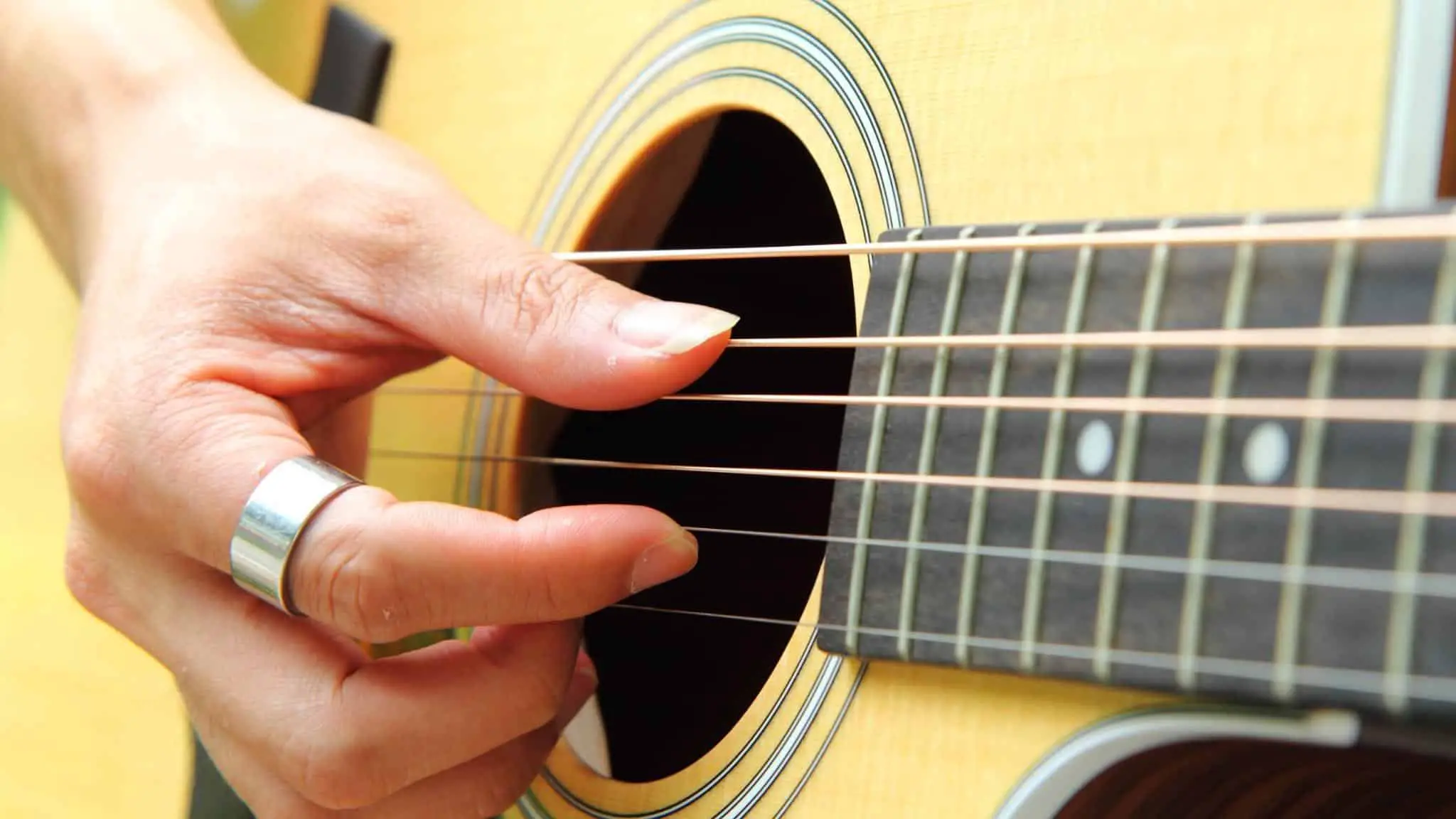 fingerpicking a guitar